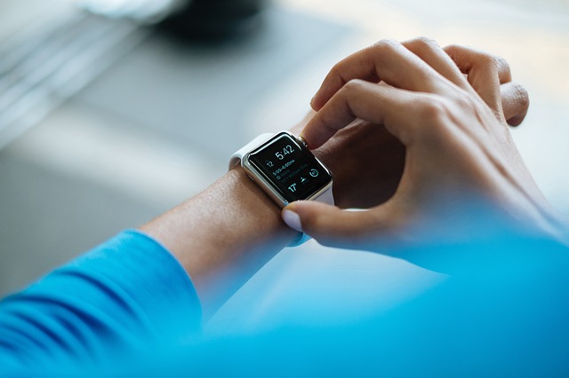 A man wearing a smartwatch A man wearing a smartwatch