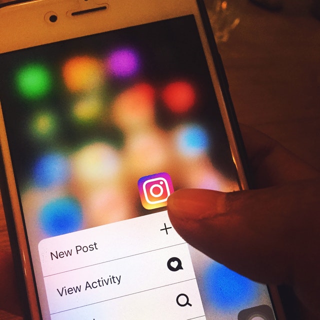 Person uploading to Instagram Person uploading to Instagram