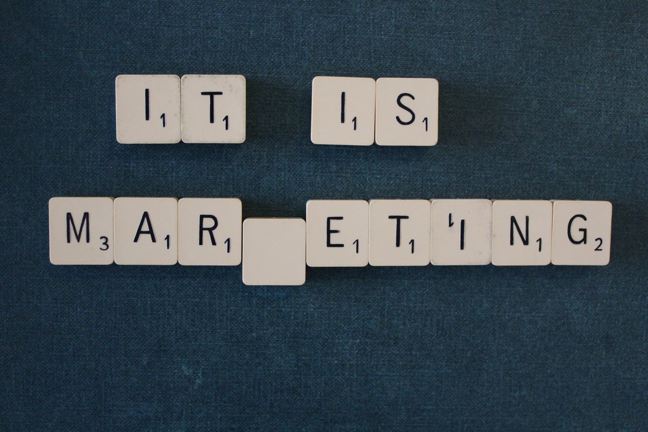 'IT IS MARKETING' written in scrabble pieces