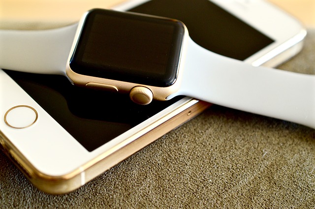 An iPhone and a Smart Watch An iPhone and a Smart Watch