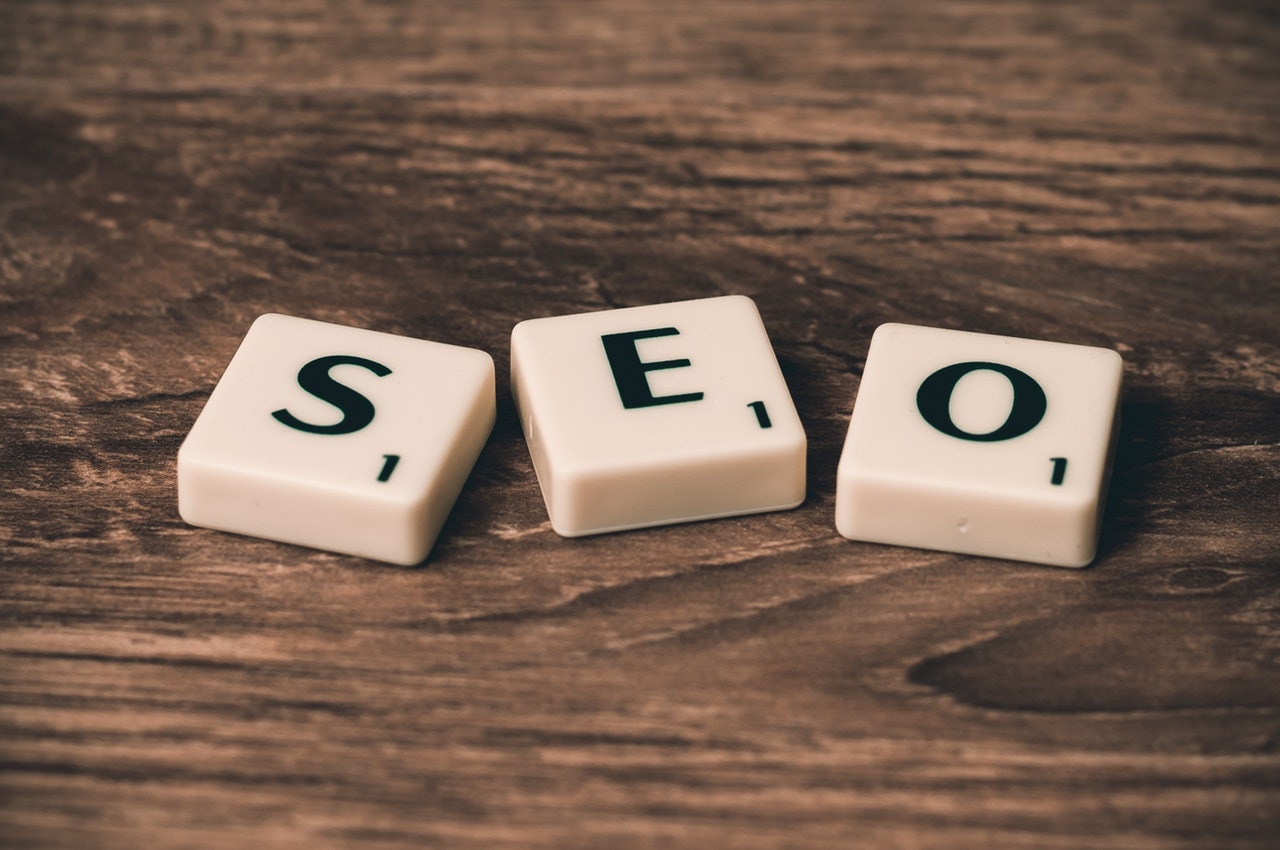 Scrabble cubes on a wooden table with the acronym SEO spelt out in the middle Scrabble cubes on a wooden table with the acronym SEO spelt out in the middle