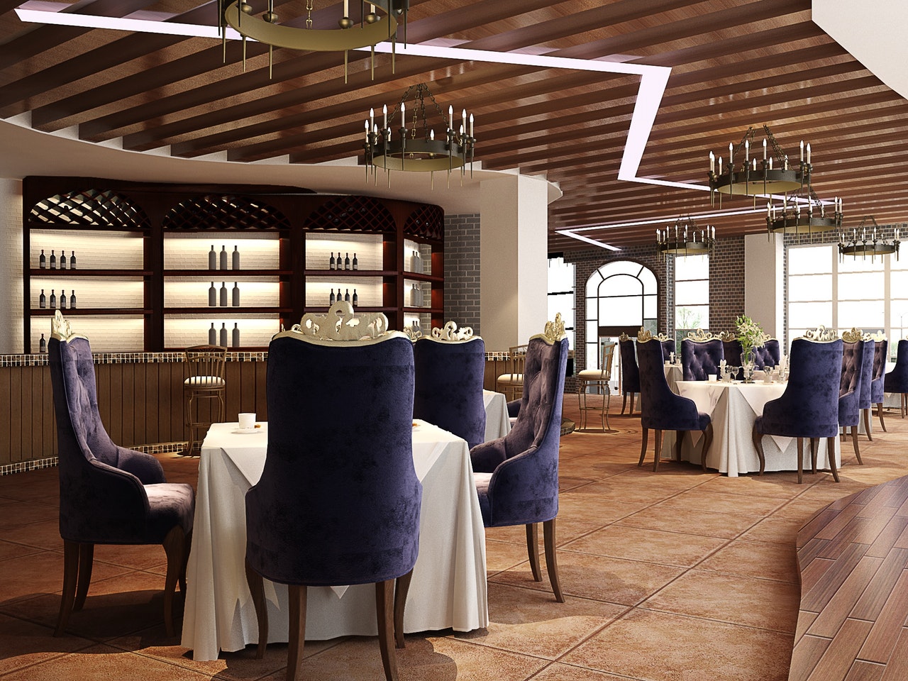A hotel restaurant featuring tables, smart chairs and a bar A hotel restaurant featuring tables, smart chairs and a bar