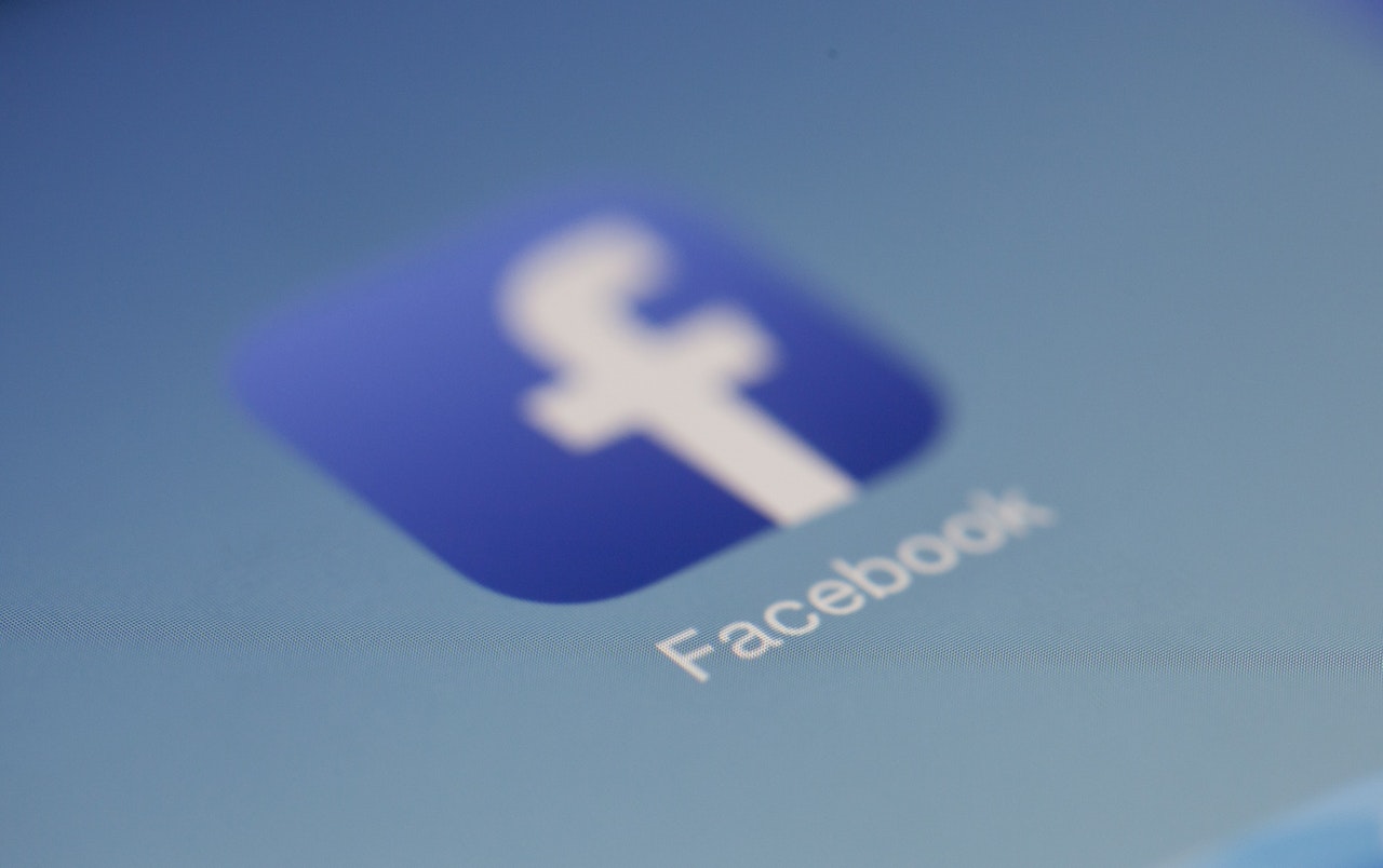 A closeup of the Facebook app logo on a mobile phone A closeup of the Facebook app logo on a mobile phone